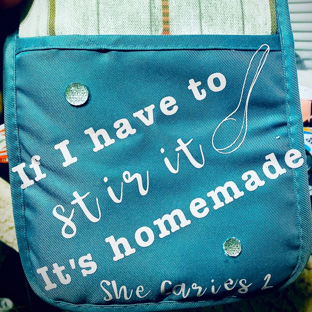 She Carries 2- Potholder